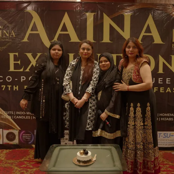 The Busiqueens team cuts the AAINA 2026 cake