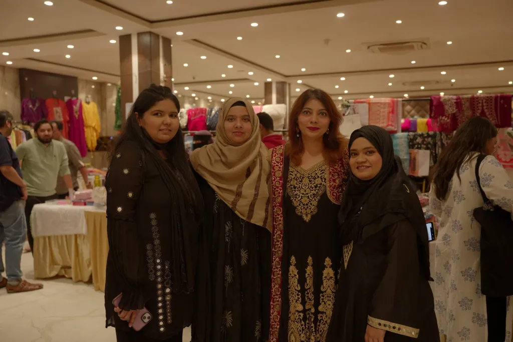 Founder Atoofa Khushnood with exhibitors on the AAINA 2026 stall floor
