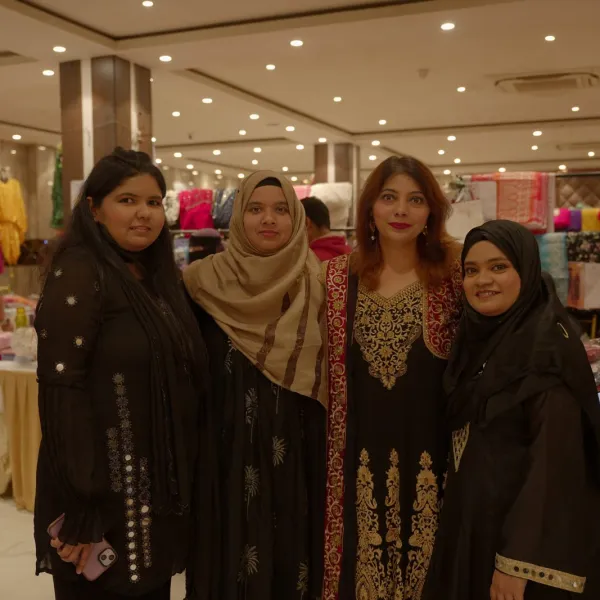 Founder Atoofa Khushnood with exhibitors on the AAINA 2026 stall floor